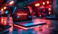 Illuminated laptop screen displaying Data Found with a vibrant red binary code background in a dimly lit urban setting Royalty Free Stock Photo