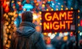 Person standing in front of a vibrant GAME NIGHT neon sign in the bustling city, reflecting the excitement and social
