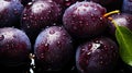 pile of fresh Italian Prune Plum fruits texture with water spots shot from a top view healty food and active lifestyle background