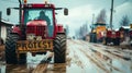 Rugged tractor with a PROTEST sign on muddy rural road during a demonstration, symbolizing agricultural activism and the Royalty Free Stock Photo