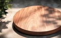 Teak wooden round smooth beautiful grain podium table tray in sunlight shadow on blank polished concrete floor for luxury organic