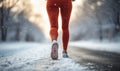 Womans Legs Jogging in Snow Winter Exercise