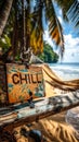 Wooden CHILL sign hanging on a hammock between palm trees on a tropical beach with a serene ocean view, epitomizing