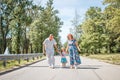 Generation concept - happy smiling grandmother, grandfather and little granddaughter walking at park Royalty Free Stock Photo