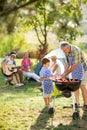 Generation family at barbecue grill Royalty Free Stock Photo