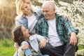 Generation Family On Grass Together in the garden Royalty Free Stock Photo