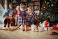 Generation people playing together with little girl on Christmas