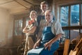 Generations of carpenters in their family business workshop Royalty Free Stock Photo