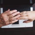 Old and young women hands at keyboard background Royalty Free Stock Photo