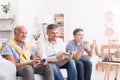 Generations of men playing game Royalty Free Stock Photo