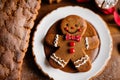 Christmas gingerbread cookies with icing sugar on the background of the Christmas tree. gingerbread man. Generative AI Royalty Free Stock Photo