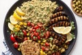 Mediterranean cuisine. Couscous with grilled chicken fillets and vegetables on plate. Generative AI Royalty Free Stock Photo