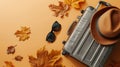 Generative AI Autumn adventure aspirations Top view photograph capturing a gray suitcase a warm felt hat and sungl Royalty Free Stock Photo