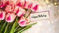 Generative AI Beautiful bouquet of tulip flowers with Happy Birthday card on light background, closeup business co Royalty Free Stock Photo