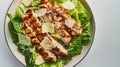 Generative AI Caesar salad with grilled chicken meat romaine and Parmesan shot from the top on a white background