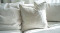 Generative AI Close up light fabric sofa with light grey pillow in warm cozy home interior background Pillows on w Royalty Free Stock Photo