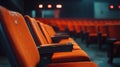Generative AI Close up of orange red seats in dark empty cinema hall with copy space Background with rows of chair