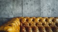 Generative AI close up vintage style of interior decoration the leather sofa and concrete wall business concept. Royalty Free Stock Photo