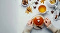 Generative AI Composition with female hands holding a cup of tea teapot cinnamon and tea bag on white background F Royalty Free Stock Photo