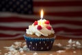 Generative Ai content. Tasty patriotic cupcake on table against USA flag. USA patriotism. Sweet dessert. American Flag