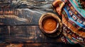 Generative AI Cooking background with empty mud dish mexican typical fabric on rustic wooden table Table top view Royalty Free Stock Photo