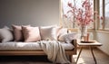 Cozy Modern Living Room with Comfortable Sofa, Soft Cushions, Elegant Throw, Wooden Side Table and Dried Flowers in Bright Royalty Free Stock Photo