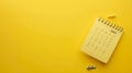 Generative AI December 2024 desk calendar on yellow background Directly above Flat lay business concept.