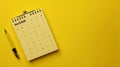 Generative AI December 2024 desk calendar on yellow background Directly above Flat lay business concept.