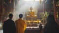 Generative AI Devotees Praying in Atmospheric Buddhist Temple Interior with Buddha Statue business concept. Royalty Free Stock Photo
