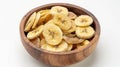 Generative AI Dried banana chips in wooden bowl isolated on white background with full depth of field Top view Fla Royalty Free Stock Photo