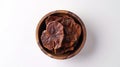 Generative AI Dry Ganioderma Lucidum mushroom Ling Zhi Lingzhi Reishi in wooden bowl isolated on white background