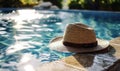 Elegant straw fedora hat resting on a poolside under the tranquil summer sun, symbolizing leisure, vacation, and the serene joy of