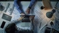 Generative AI Engineer and architect working together brainstorming and designing blueprint using laptop working w Royalty Free Stock Photo