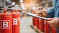 Generative AI Fire Safety Inspection Technician Inspecting Fire Extinguishers with Checklist in Warehouse Ensuring Royalty Free Stock Photo