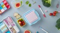 Generative AI Flat lay composition with lunch box tasty healthy food and school stationery on grey table business Royalty Free Stock Photo