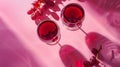 Generative AI Flatlay of red wine in glasses Branch of grape vine and grape on pink background Wine bar winery win Royalty Free Stock Photo