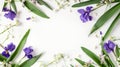 Generative AI floral frame with purple iris flower lily of the valley branches leaves and petals isolated on white Royalty Free Stock Photo