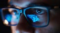 Generative AI Focused developer coder wears glasses working on computer looking at programming code data cyber sec