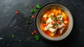 Generative AI Fresh fish soup in bowl on black background top view business concept. Royalty Free Stock Photo
