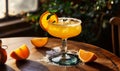 Golden Orange Margarita Cocktail with Salt Rim and Citrus Garnish in Elegant Glass, Refreshing Alcoholic Beverage in Sunlit Royalty Free Stock Photo