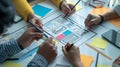 Generative AI Group of designers draw a ux website to develop a mobile application at meeting business concept.