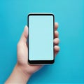 Hand holding smartphone in a blue background Royalty Free Stock Photo