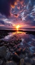 Beautiful cloudy sunset over the rocky sea shore at evening Royalty Free Stock Photo