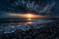 Beautiful cloudy sunset over the rocky sea shore at evening Royalty Free Stock Photo