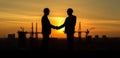 generative AI illustration showcases two silhouetted engineers in safety hard hats, shaking hands against the backdrop of a