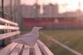 Generative AI Image of Bird Origami Paper Craft on White Bench in City Park