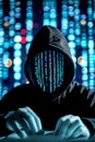 Computer hacker with hoodie working on dark web, ready to steal your data. Cybersecurity concept.