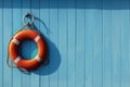 Generative AI Image of Lifebuoy Ring Hanging on Blue Wooden Wall Background with Copy Space