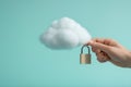 Secure cloud computing concept image with a padlock nestled on the cloud