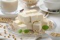 Generative AI Image of Slices of White Tofu with Soybean Seeds on Glass Plate Royalty Free Stock Photo